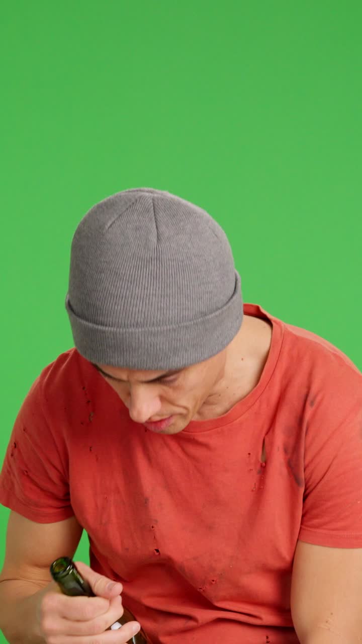 Drunk man staggering. Eventually he feels sick and collapse