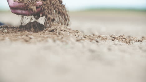 Soil-Agriculture-Sunlight-Farmer-Hands-Holding-And-Pouring-Back-Organic-Soil-