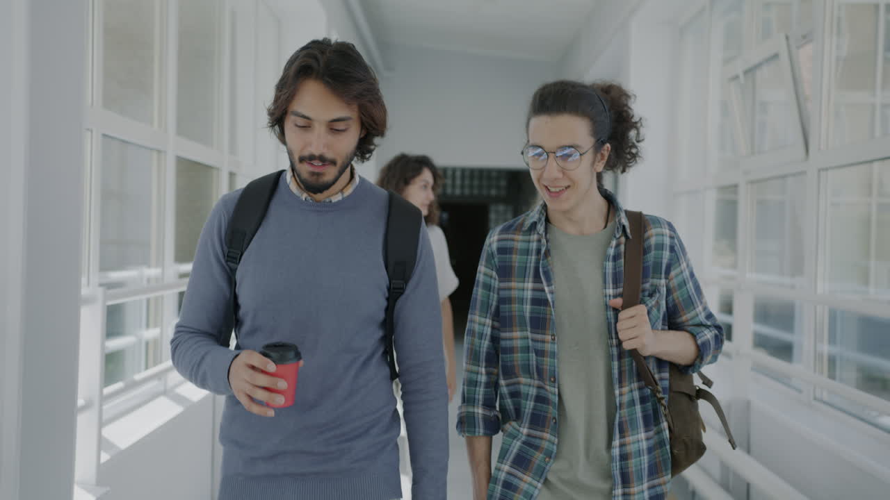 Students walking in a university hallway