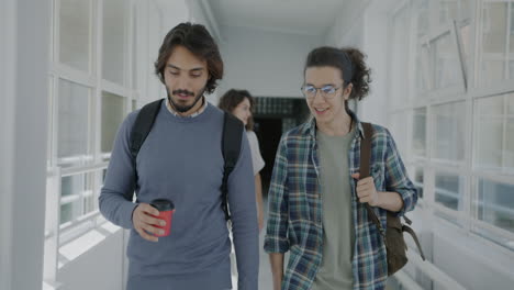 students walking in a university hallway