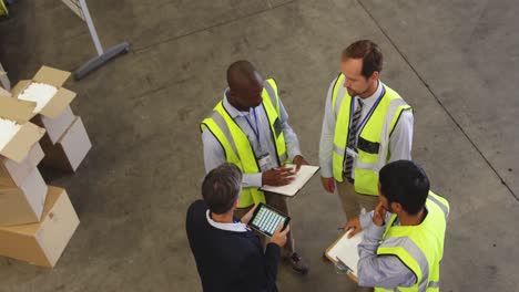 staff meeting on the warehouse floor 4k