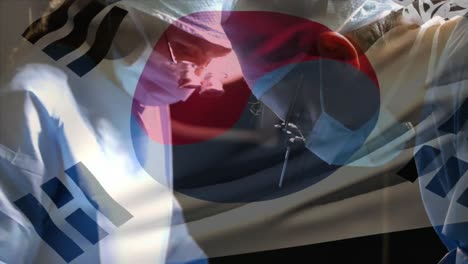 animation of flag of south korea waving over surgeons in operating theatre