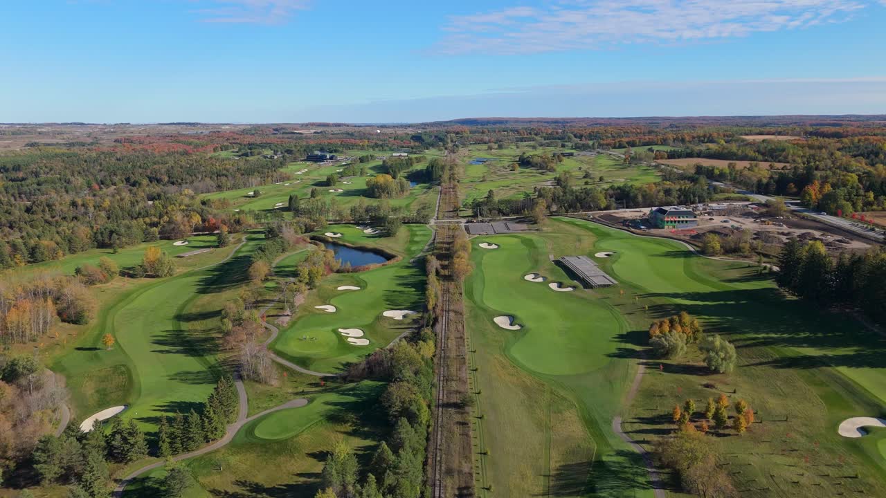 Forward drone over Osprey Valley golf course in Caledon, fall colours, Aerial