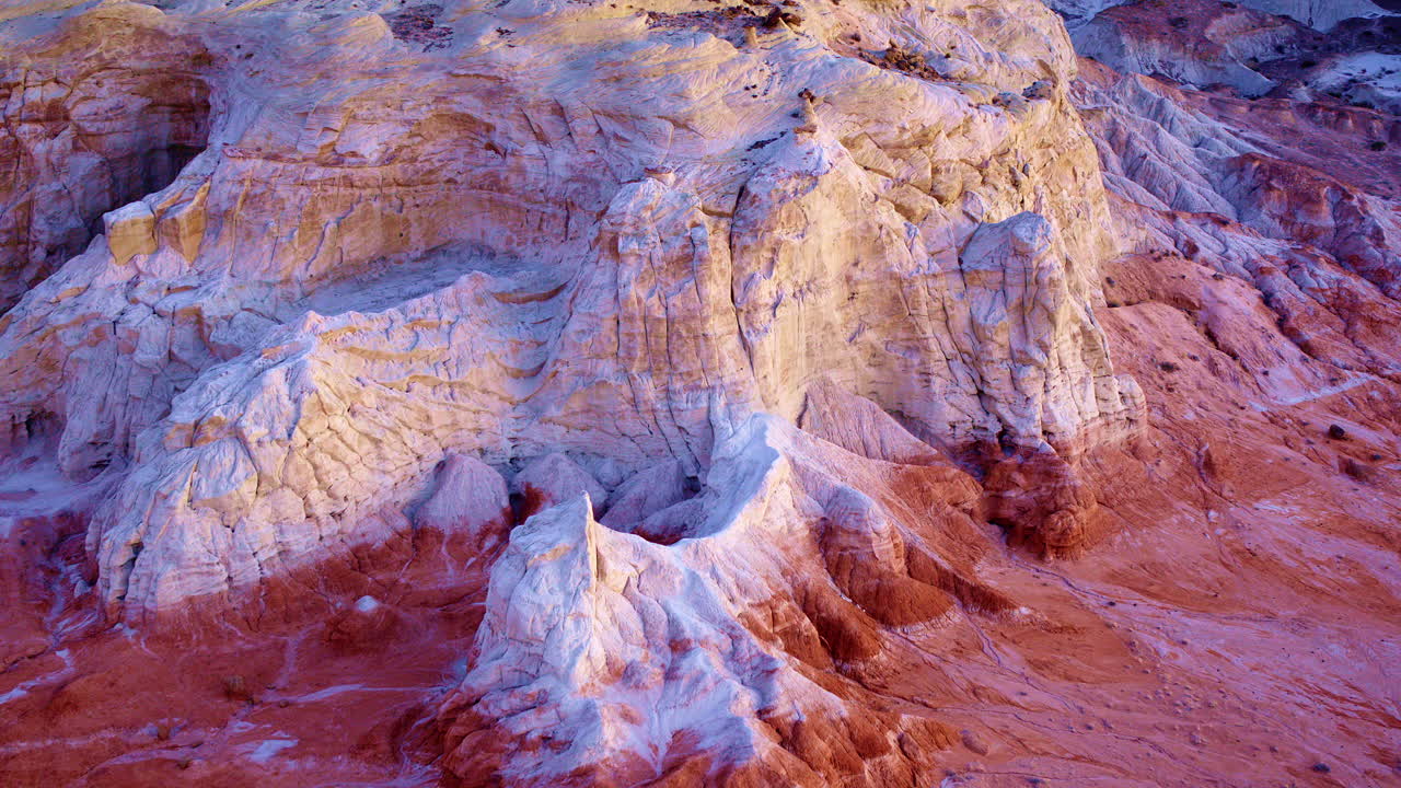 Slow, cinematic drone footage showcases the vibrant hills and distinctive hoodoos near the Utah-Arizona border.