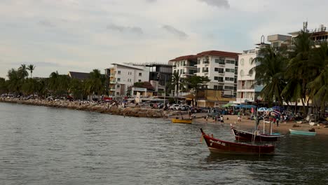 boats near a busy beach in chonburi