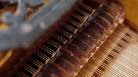 dusty old moving hammers inside grand piano