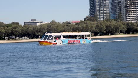 a boat cruises along the gold coast shoreline