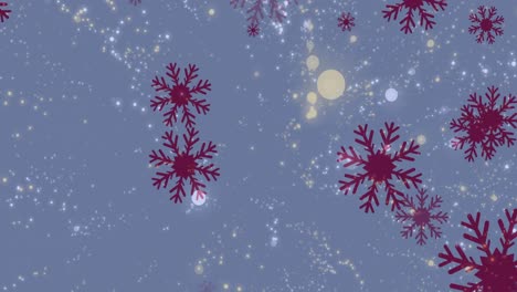 Multiple-snowflakes-icons-falling-over-glowing-spots-of-light-against-blue-background