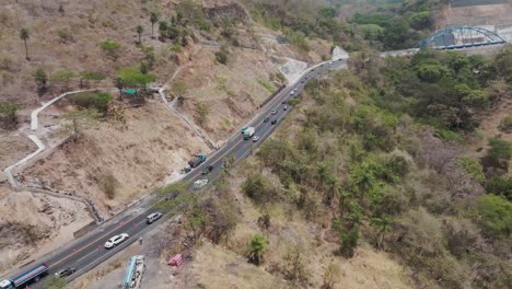 aerial view of a winding highway through arid hills