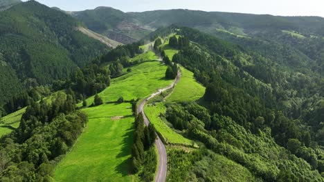 car races down curvy dusty mountain road for azores rallye 2023