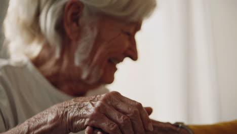 close-up of elderly hands holding together