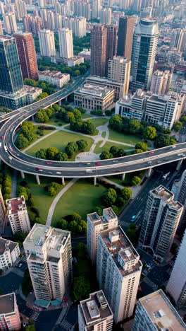 aerial view of city with overpass and park