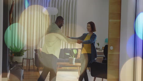 dancing couple in living room with colorful bokeh lights animation
