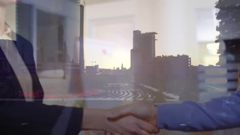 digital composition of mid section of businessman and businesswoman shaking hands against cityscape