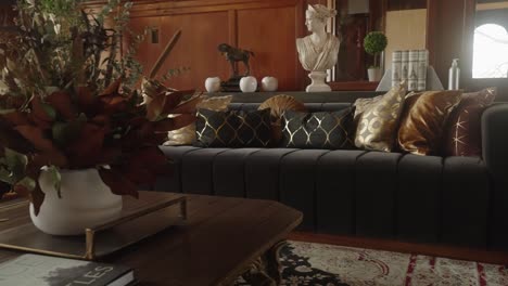 retro black couch in a 1900's mansion living room