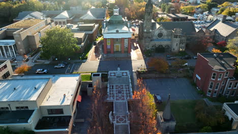 aerial establishing shot of beautiful town buildings in golden hour light