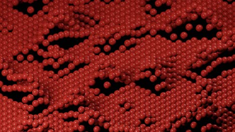 red 3d balls wavy movement on a black background. simple motion graphic looped animation