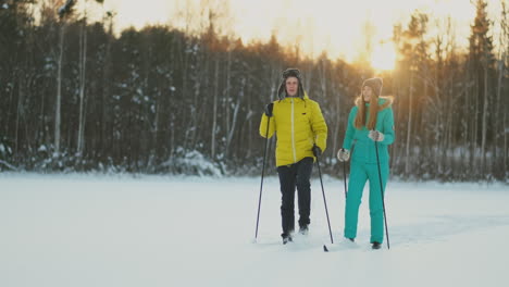 family skiers spend the weekend together doing skiing in the woods. healthy lifestyle and active rest.