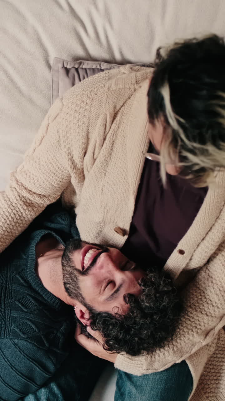 Gay Couple Relaxing Together At Home