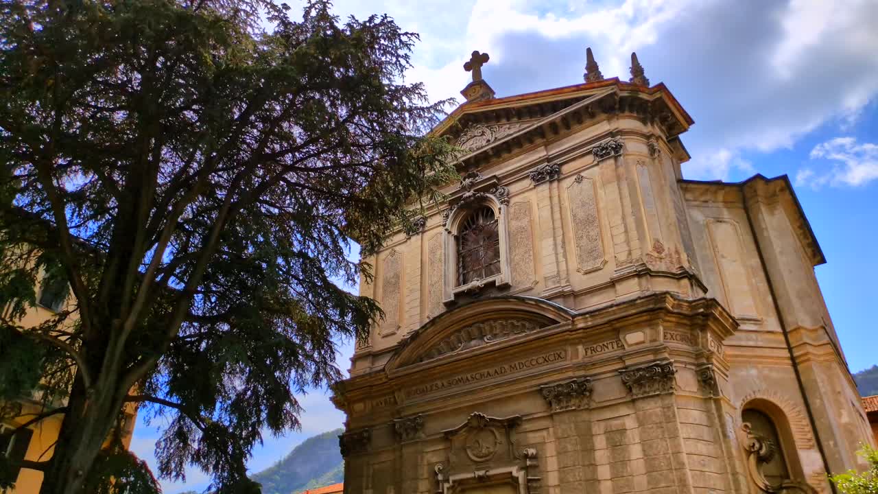 Static timelapse of the Chiesa di Sant'Andrea Apostolo church in Brunate, Lake Como, Italy on a warm sunny day. Filmed in 4K, 30 frames per second and in Rec709 color space.