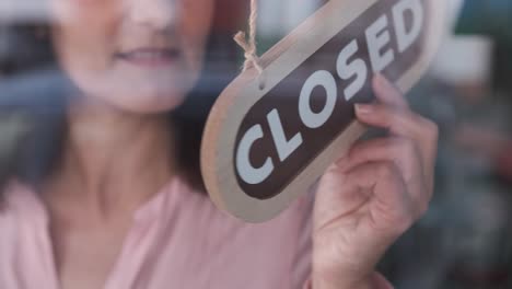 small business opening up. turning the sign from close to open. 4k 60fps