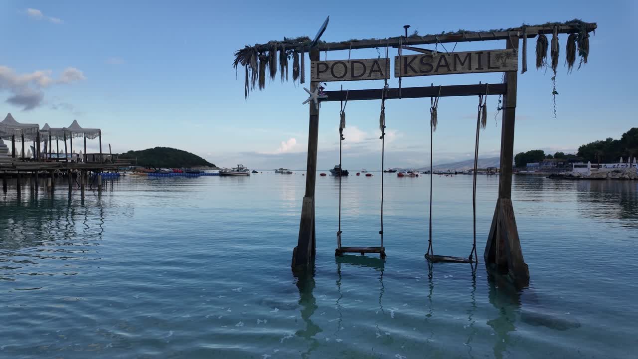 Poda Ksamil Albania beach sea swing empty early morning summer holiday destination
