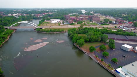 Inspiring-aerial-of-Rock-River,-Morgan-Street-Bridge,-The-pedestrian-bridge-from-Rockford-Illinois,-USA