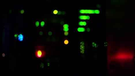 blurred background of led lights of server telecommunications equipment, abstract close-up