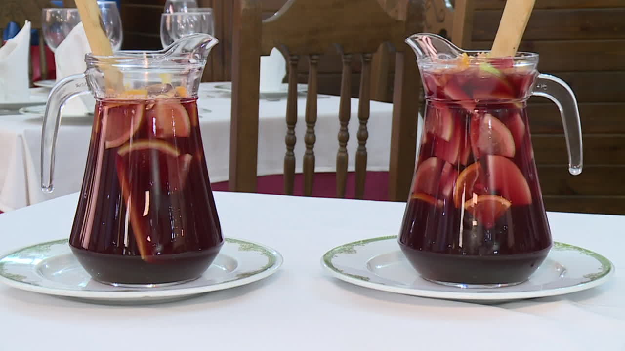 Two pitchers of Sangria on a table in a restaurant