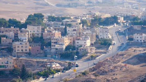 multi story houses, apartments and traffic in the arabian city of al-karak from kerak castle in jordan, middle east