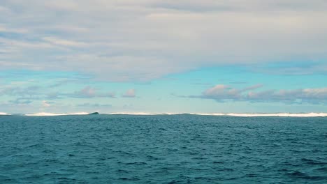 HD-120fps-Hawaii-Kauai-Boating-on-the-ocean-floating-left-to-right-surfers-wait-for-waves-in-distance