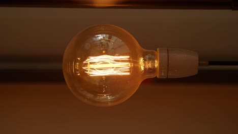 close-up of an illuminated edison light bulb
