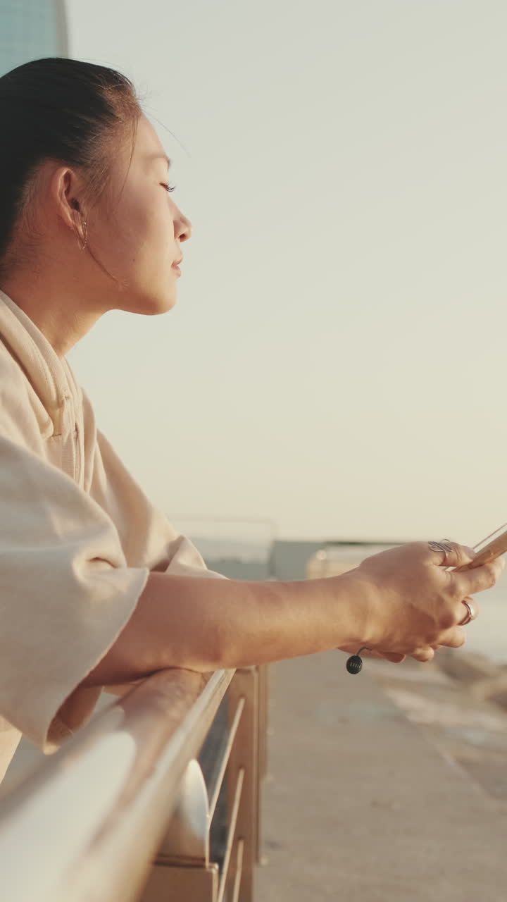 Woman using her phone outdoors