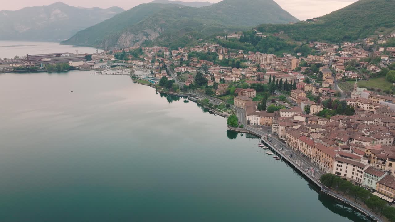 Aeriel view of Lake Iseo at sunrise, on the right the city of lovere which runs along the lake,Bergamo Italy.