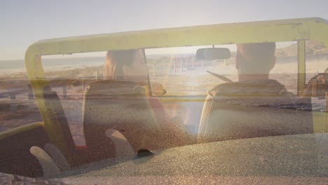 Animation-of-light-over-happy-caucasian-couple-in-car-on-beach