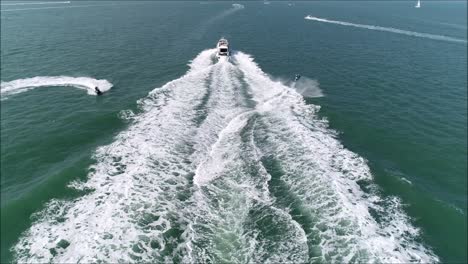 jetski jumping over a motorboat wake-1