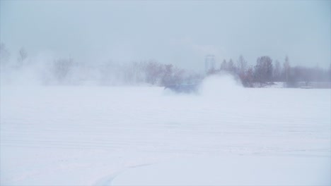 car drifting on frozen lake in winter