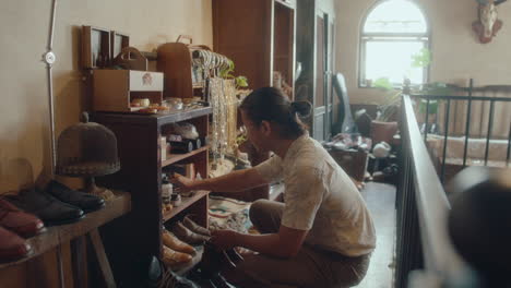 asian man working in consignment store