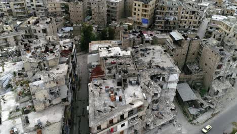 aerial view over the streets in aleppo, syria. people live their life between the ruins of the city 4k