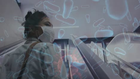 animation of covid 19 cells moving over woman in face mask
