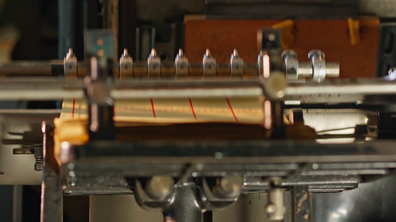 Close-up of Vintage Printing Press Operating and Feeding Paper