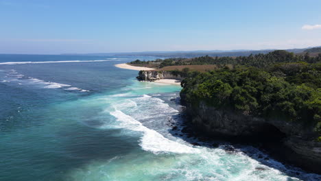 foamy waves crashing on the rugged cliffs in pantai watu bella in west sumba regency, east nusa tenggara, indonesia