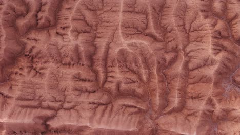 drone establishing shot of rugged road through atacama desert, northern chile.