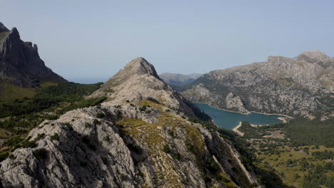 Rocky-mountain-crest-in-Mallorca-with-Gorg-Blau-water-reservoir-below