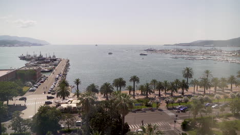 View-over-beautiful-streets-and-harbor-from-hotel-room-in-La-Spezia,-Italy---slow-motion-reveal