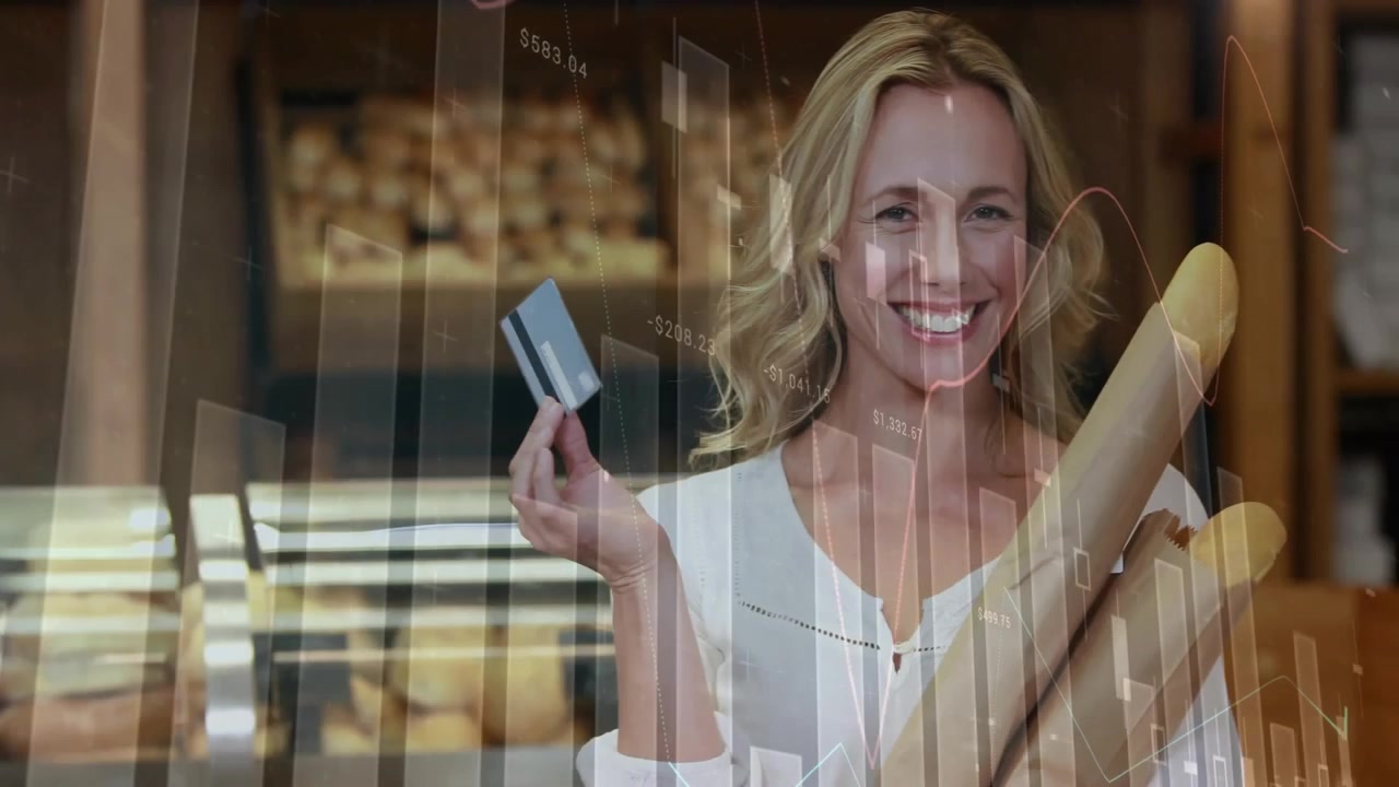 female bakery customer holding credit card and baguettes, displaying floating financial charts