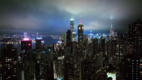 a view of a city at night from the top of a skyscraper