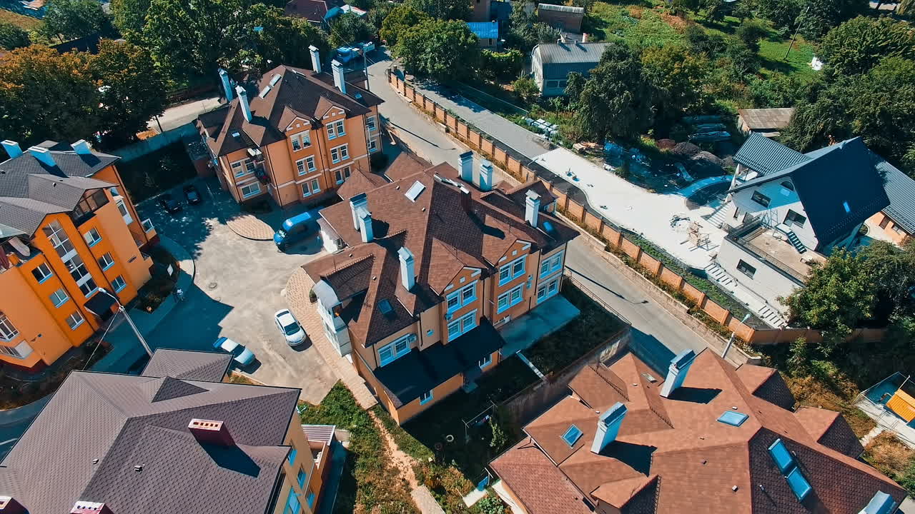 Cityscape View From Above. Aerial shot of the houses and streets of small city at day
