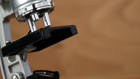 Close-up-of-microscope-on-a-table