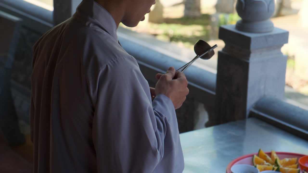 Buddhist Monk Performing a Ceremony